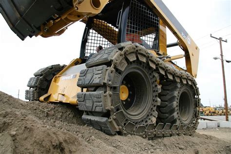 skid steer tracks in snow|wheeled vs tracked skid steer.